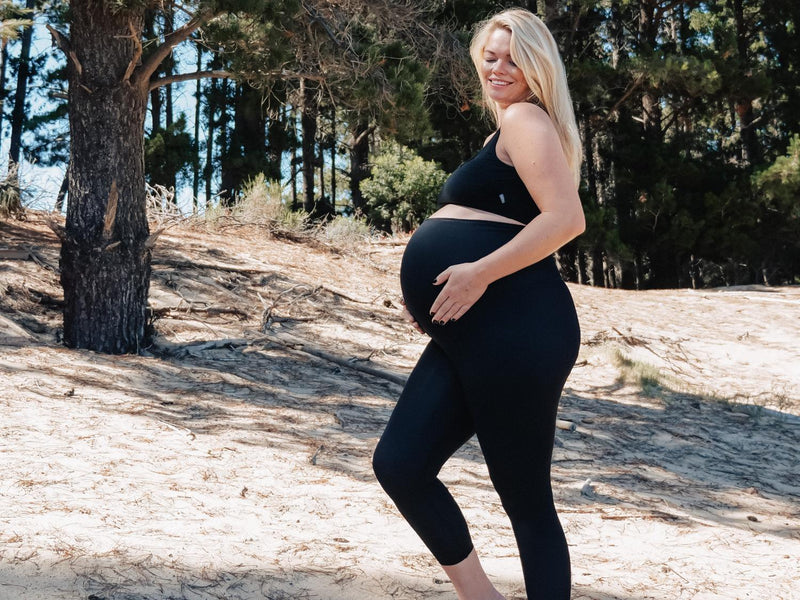 Pregnant mom wearing Cherry Melon Activewear